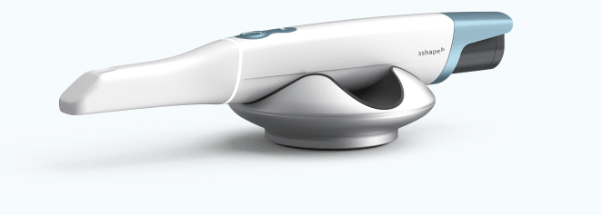 3Shape TRIOS 6 intraoral scanner resting in its charging pod