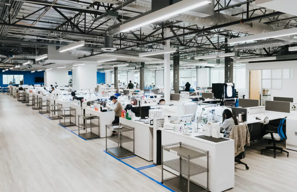 large open office space of technicians making teeth