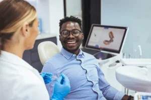 Man sitting dentist chair waiting for dental work